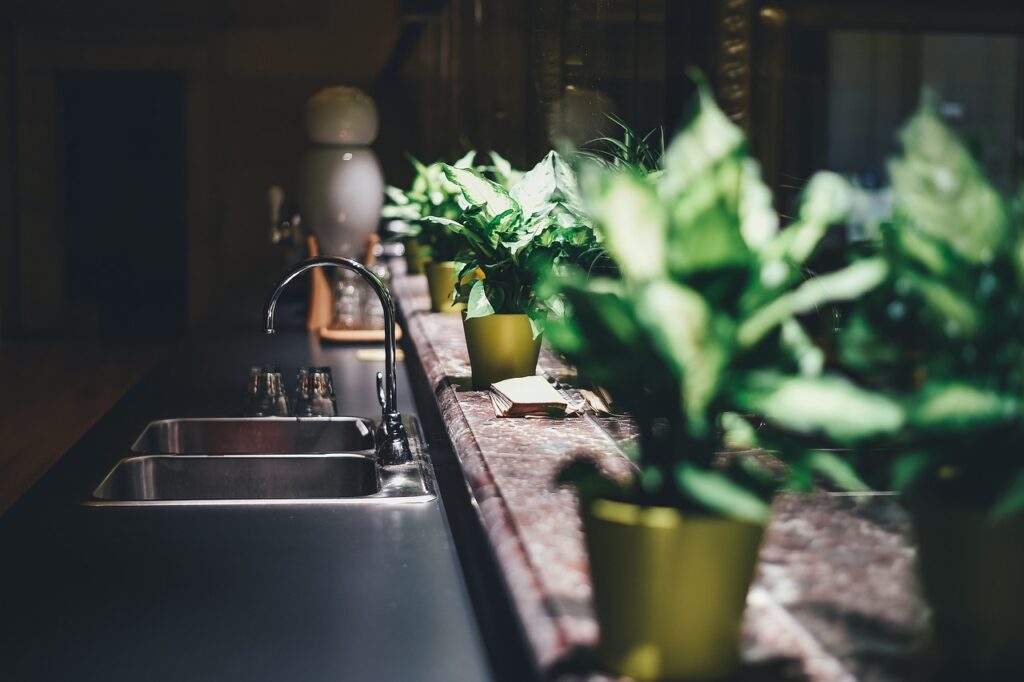 A beautiful steel kitchen sink with flower